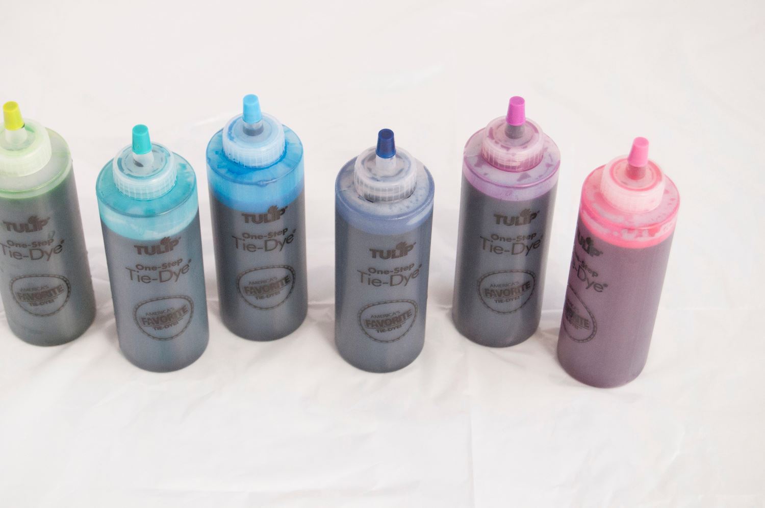 Add water to dye bottles and shake to mix