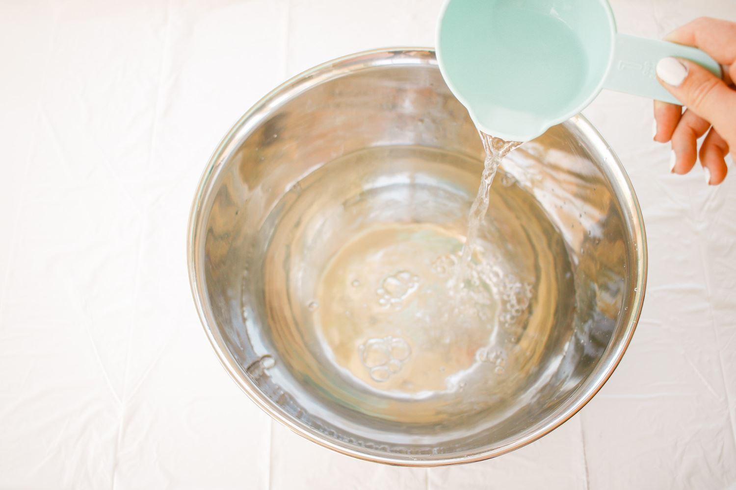 Add warm water to mixing bowl