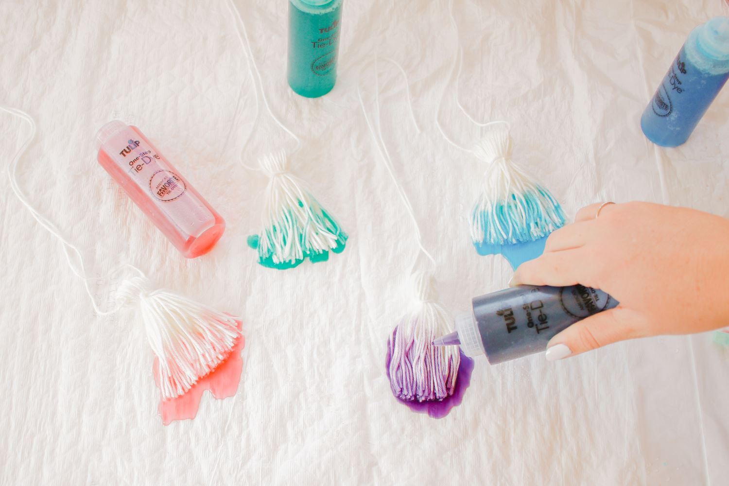 Squeeze dyes onto tassels