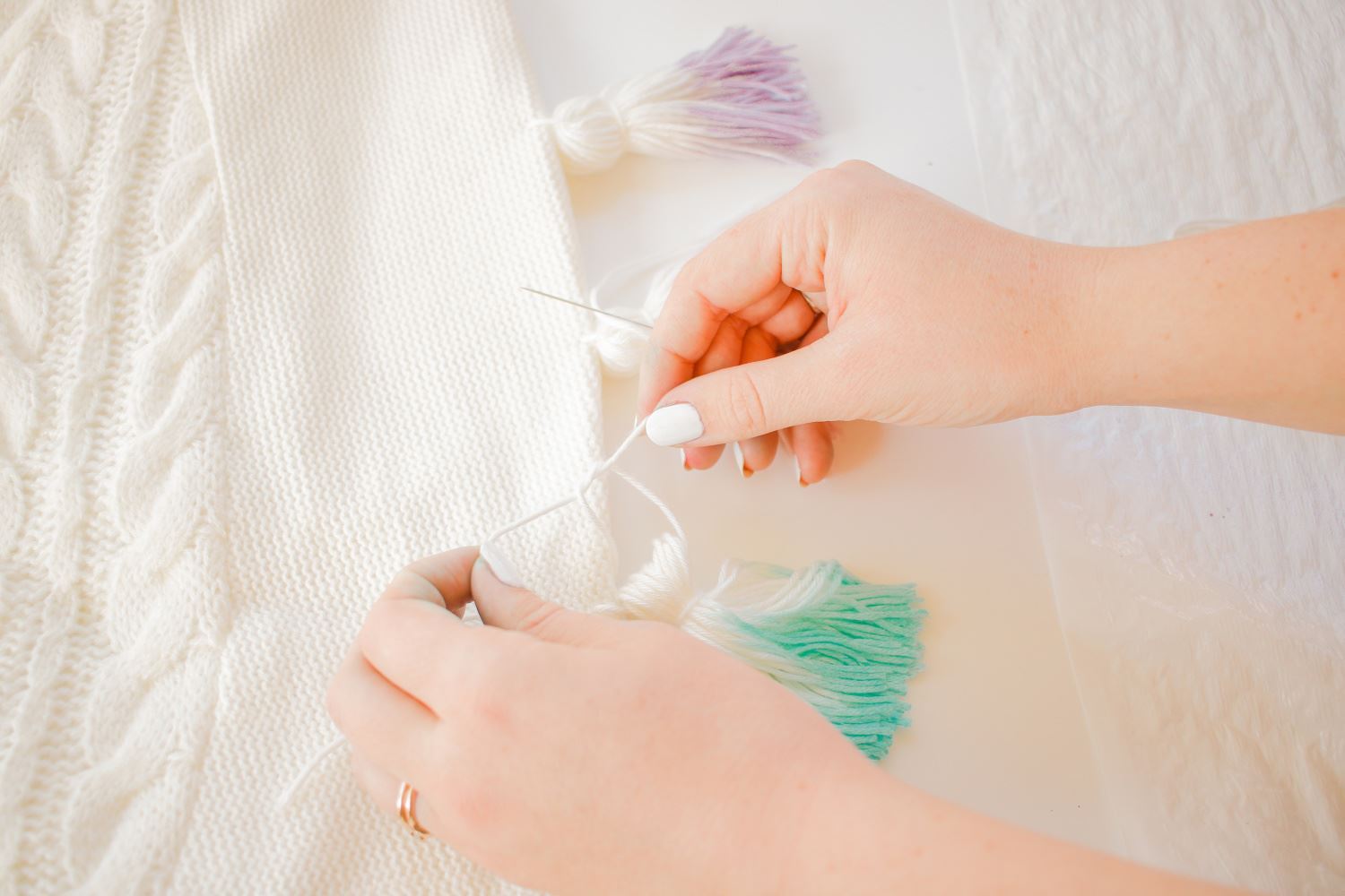 Sew and tie tassels to tree skirt