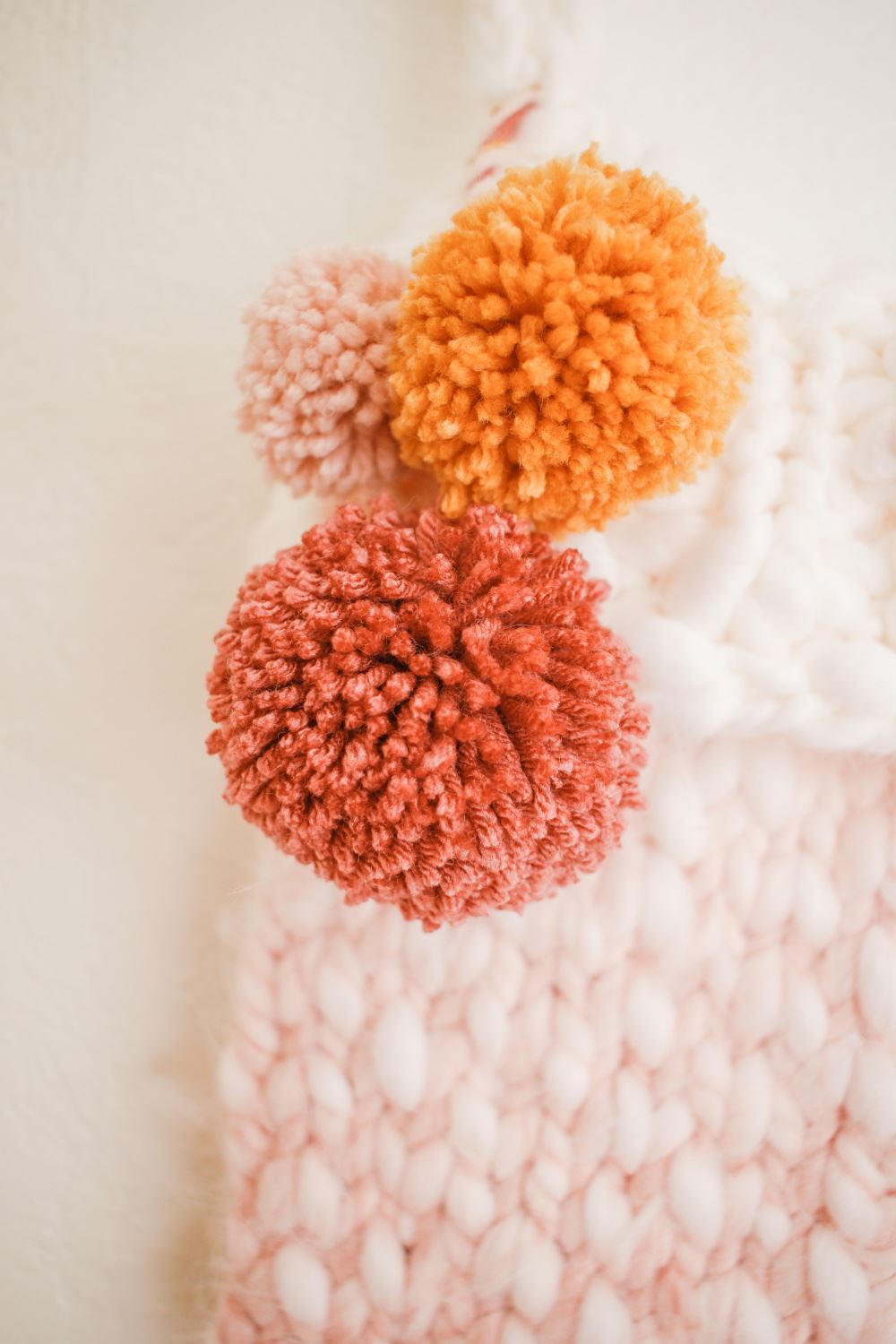 Attach pompoms to stockings