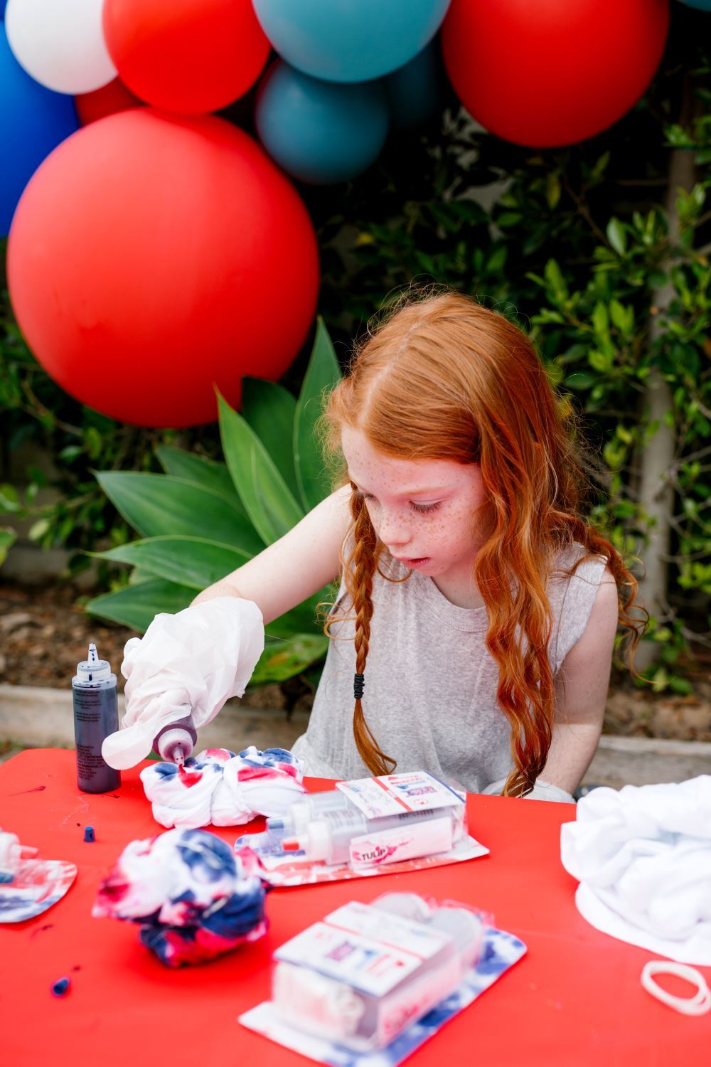 Apply red and blue tie dye to shirts