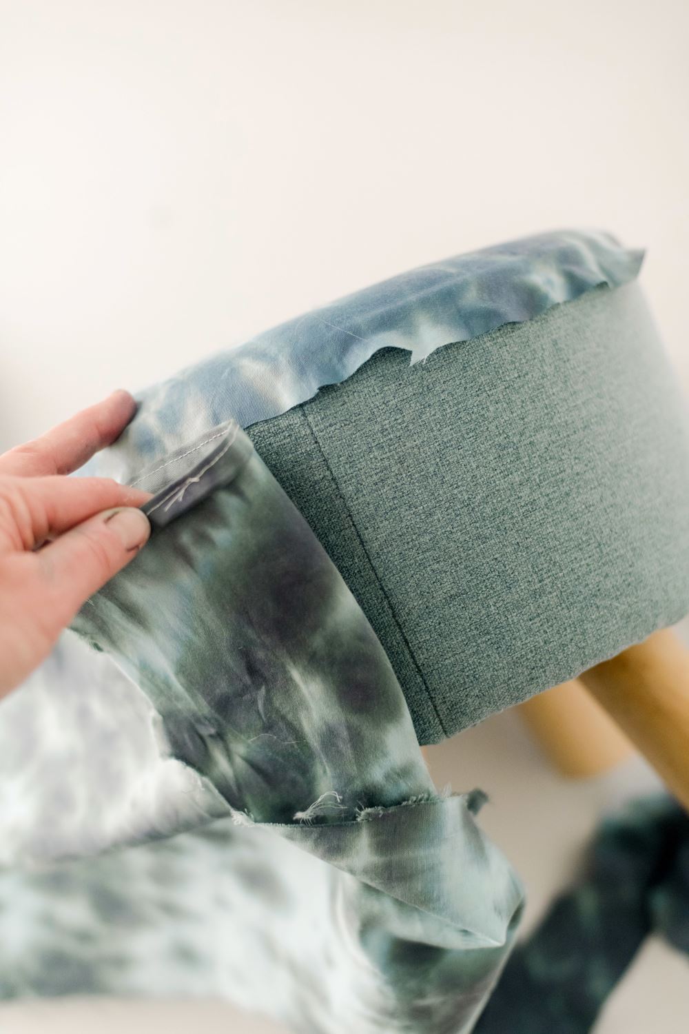 Wrap fabric along the long edge of your furniture.